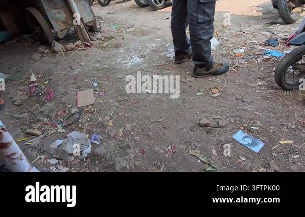 Video of Person standing near broken bike on dirt ground. Scattered ...