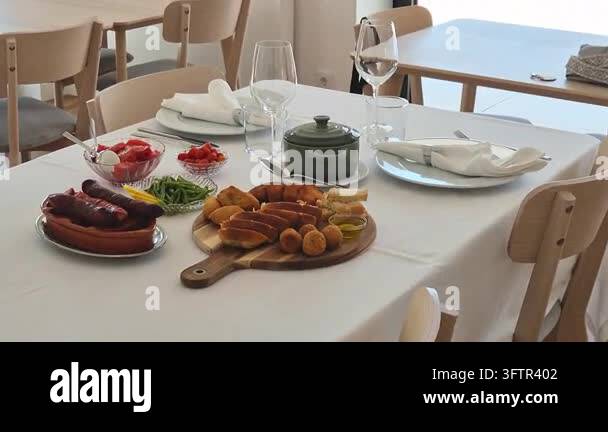 Elegant table setting for two with a traditional Portuguese lunch ...
