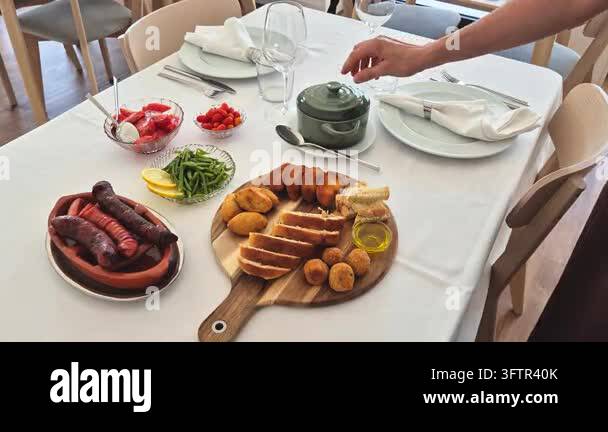 Elegant table setting for two with a traditional Portuguese lunch ...