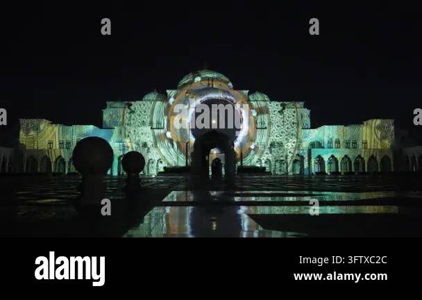 Nighttime projection mapping show on a grand building facade with ...