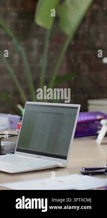 Vertical video: HUD appearing over laptop, expanding hex icons, panning ...