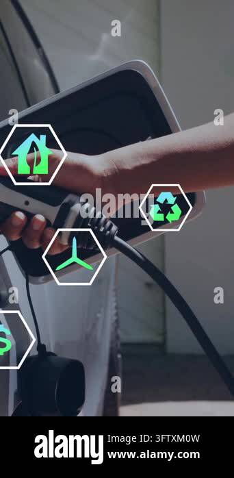 Animation of ecology icons over caucasian man charging electric car ...