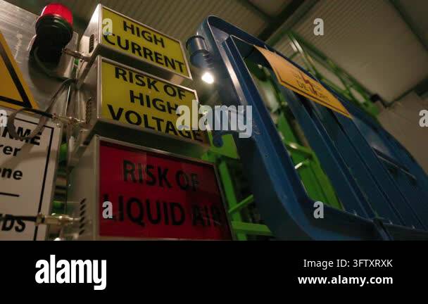Close-up of a high voltage warning sign inside a CERN laboratory Stock ...