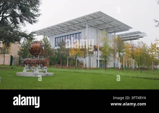 Modern building with solar panels and scientific artifact on the CERN ...
