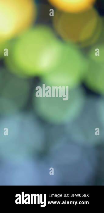 Blurred lights dance in soft motion. Abstract vibe. Vertical video ...