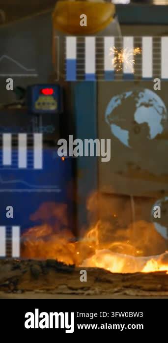 Vertical video: Man monitoring panel while walking by furnace, sparks ...