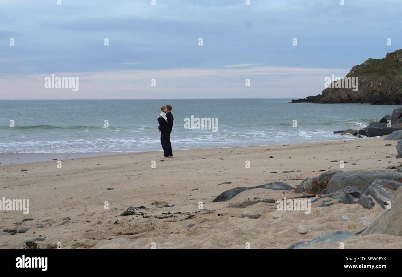 father holding and hugging kid son on beach at sunset Stock Video ...