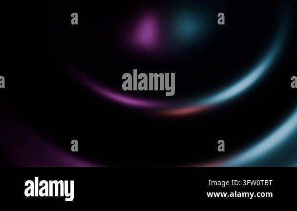 Abstract swirling light gradients moving against dark background ...
