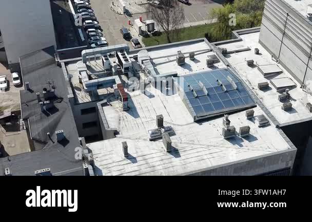 Modern rooftop HVAC units and solar energy panels from above Stock ...