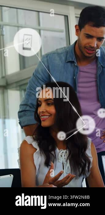 Vertical video: Woman using pen starting moving phone tech icons across ...