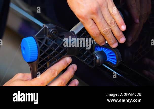 Removing dents on the car. PDR technology. Car body repair without ...