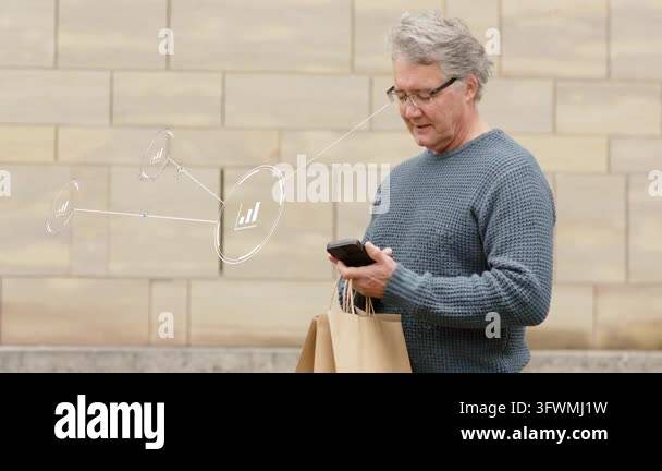 Senior man holding bags, tapping phone initiating finance network of ...