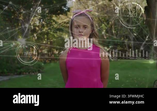 Female child standing on lawn, HUD overlays with graphs sweeping across ...