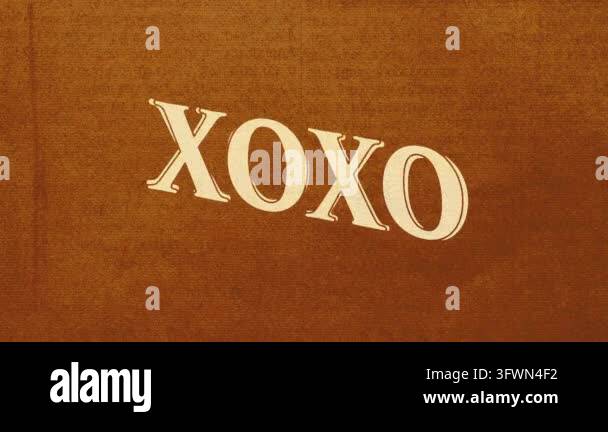 Text 'XOXO' in a warm brown background texture Stock Video Footage - Alamy