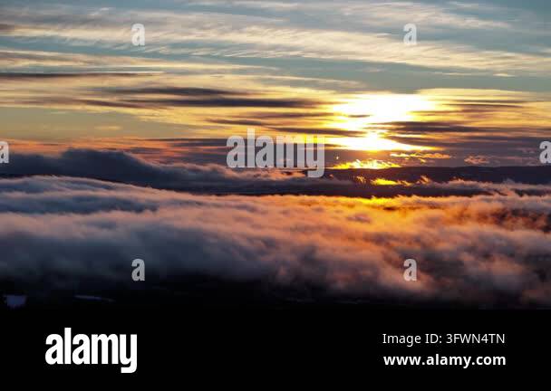 Sunset over clouds with colorful sky in background Stock Video Footage ...