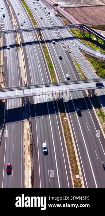 Wide highway with overpasses and moving traffic, Valencia. Several ...