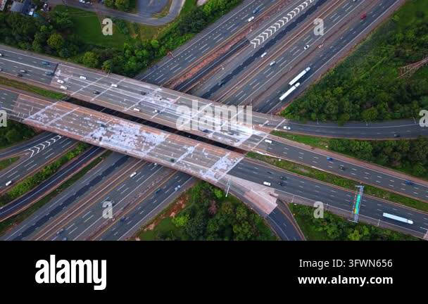 Crossing Light Sign Weathered parallel overpasses crossing a highway diagonally. Light ...