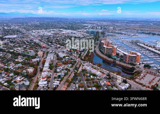 A water channel separates apartment towers from coastal neighborhoods ...