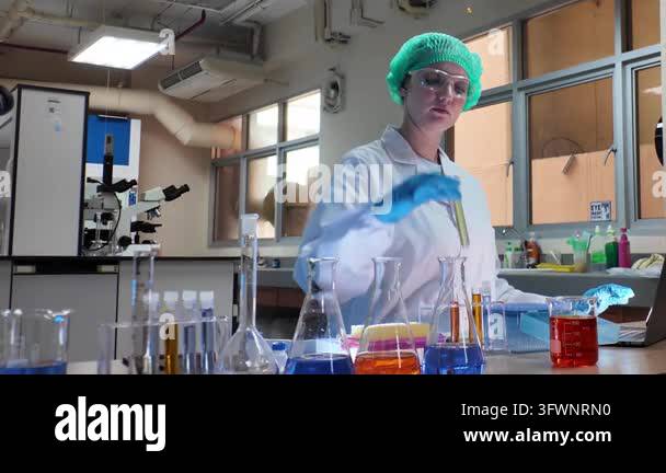 Microscopes Laboratory room. Female scientists conducting laboratory research with ...