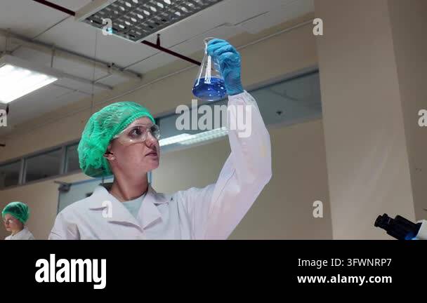 Laboratory room. Female scientists conducting laboratory research with ...