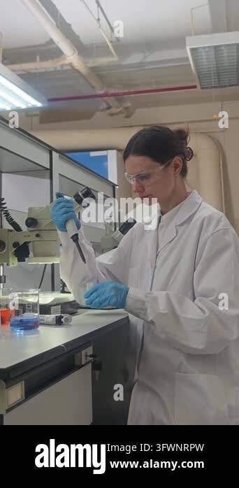 Laboratory room. Female scientists conducting laboratory research with ...