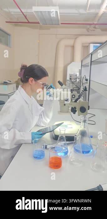 Laboratory room. Female scientists conducting laboratory research with ...