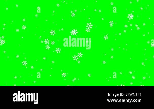 White snowflakes drift downward across a solid green chroma key ...