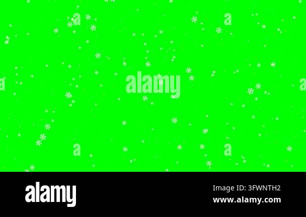 White snowflakes drift downward across a solid green chroma key ...
