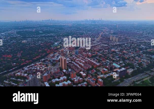 Expansive panorama of dense urban cityscape on a foggy dull day. Drone ...