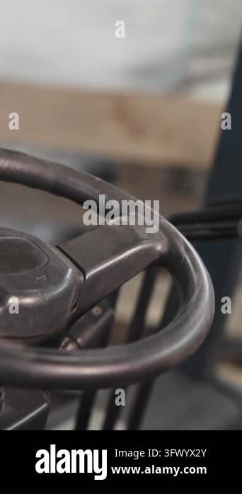 Stationary metal hand crank shown in close-up with slightly angled ...