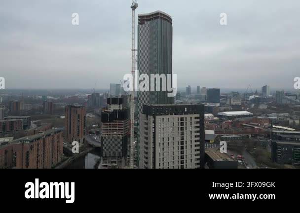 High-rise buildings under construction in an urban cityscape with ...