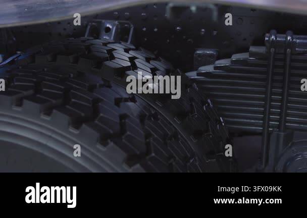 Create Leaf Spring Foreground dual tires show deep grooves and matte rubber between glossy ...