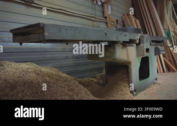 Interior woodworking workshop scene showing stationary jointer planer ...