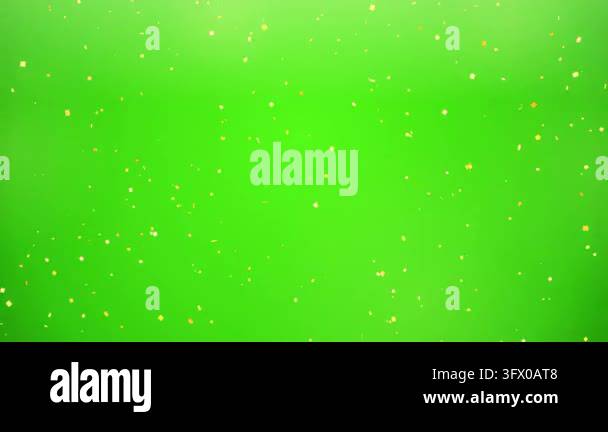 golden confetti falling down on green screen background for chroma key ...