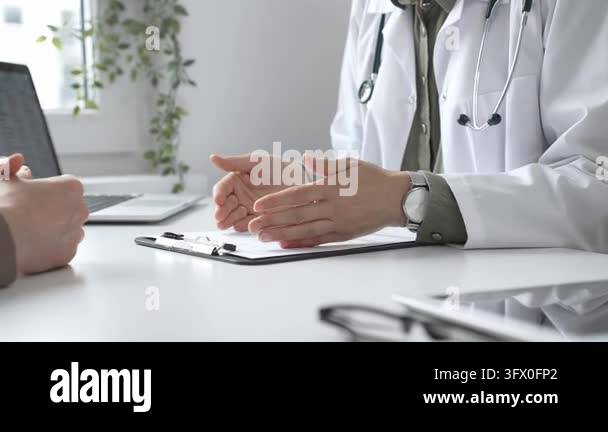 Doctor is explaining diagnosis to patient during a medical consultation ...