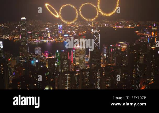 A stunning nighttime view of Hong Kong skyline illuminated by colorful ...