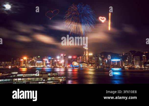 A panoramic view of the city skyline illuminated by fireworks ...