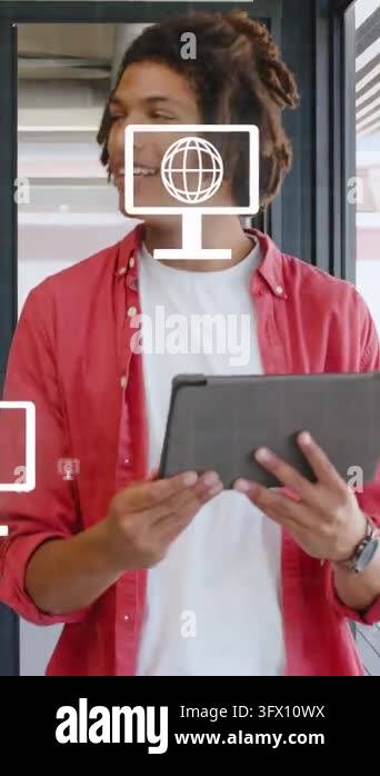 Vertical video: Man tapping tablet at window making tech icons floating ...