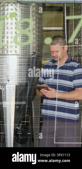 Vertical video: Plant tech tapping tablet at tank, causing green grid ...