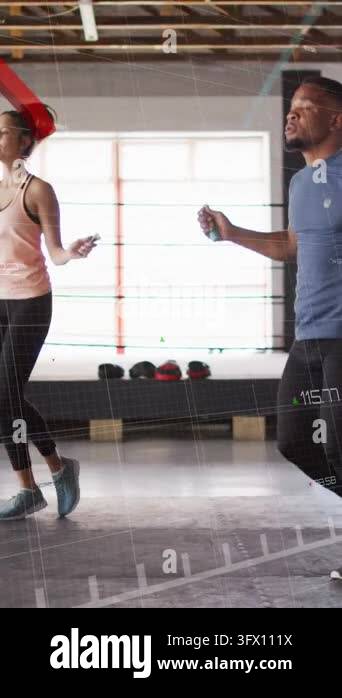 Vertical video: Fitness duo starting ropes by bench, syncing jumps ...