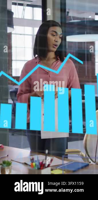 Vertical video: Woman glancing at report pointing to glass chart ...