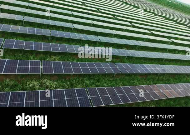 Long solar strips sweep diagonally above bright vegetation, creating ...