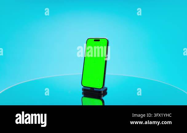 Close composition presents smartphone with green chroma key display and ...