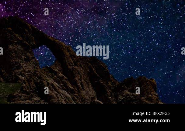 Natural rock arch formation under a stunning starry night sky and Milky ...