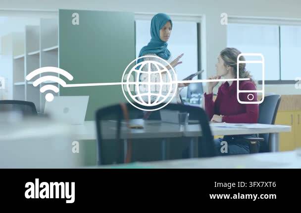 Standing woman tapping tablet explaining to colleague in tech reviewing ...