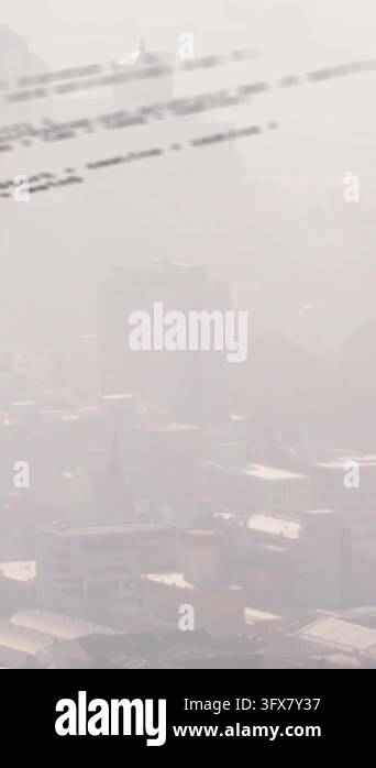Animation of computer language over aerial view of modern cityscape ...
