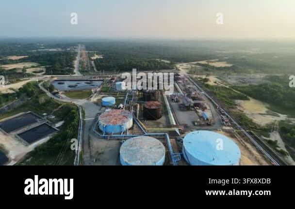 Aerial overview tracking across a sprawling oil and gas refinery plant ...