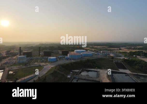 Aerial overview tracking across a sprawling oil and gas refinery plant ...