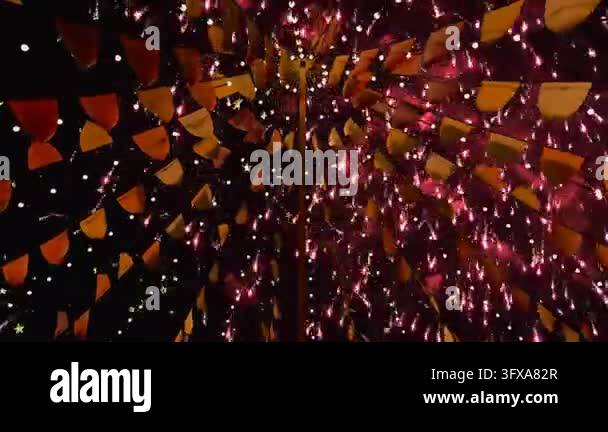 First rockets launching, fireworks bursting, canopy framing upward ...