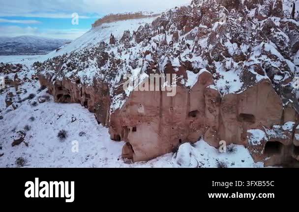 Snowy rocky landscape with cliffs and blue sky Stock Video Footage - Alamy